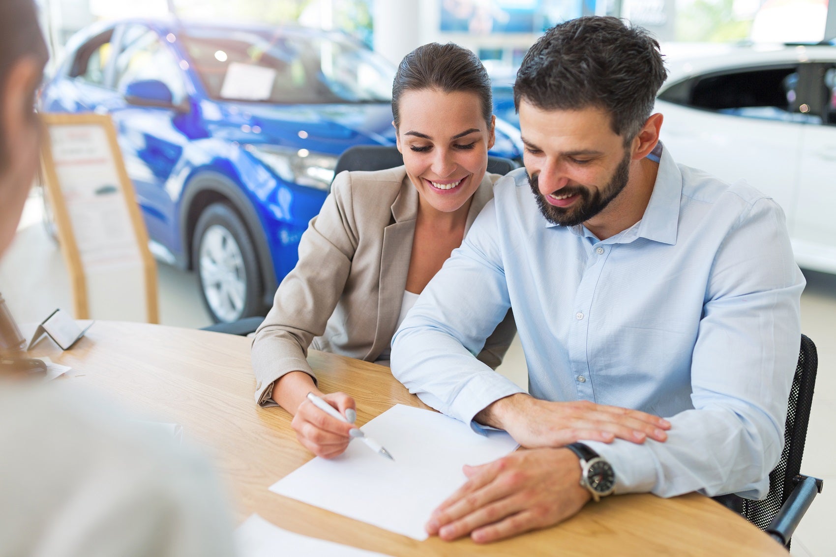 Couple Learning the Difference Between Buying vs Leasing
